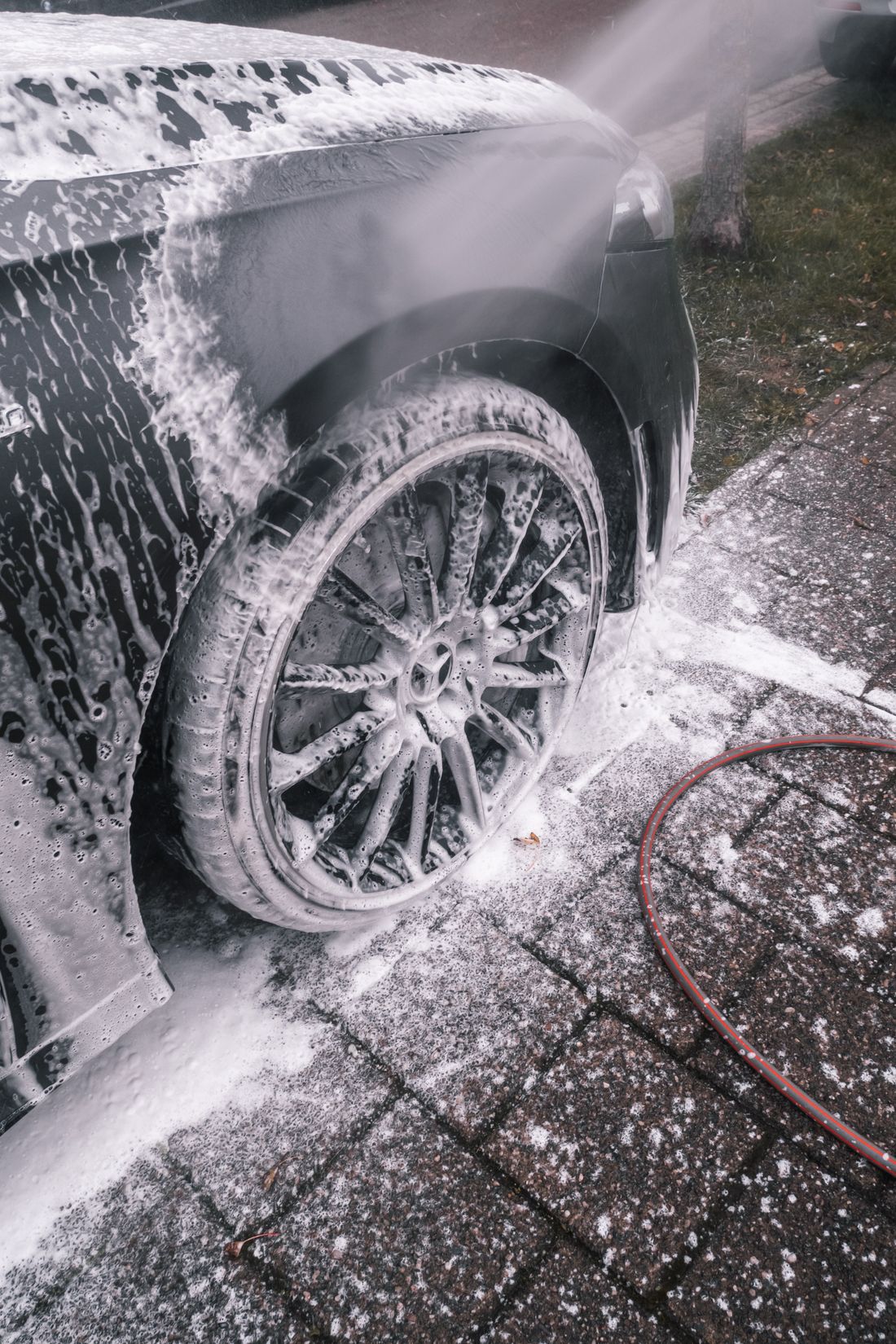 Snow foam on a wheel during a hand wash